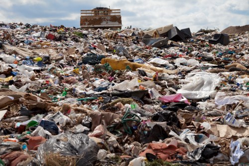 Workers managing builders waste on a construction site